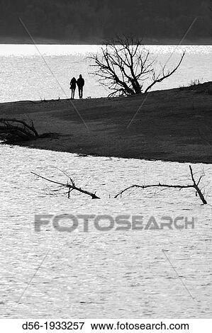 Stock Photo - A couple at Sau swamp, Barcelona province, Catalonia, Spain. Fotosearch