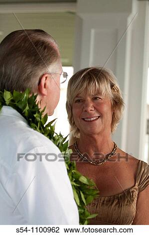 A couple during their Hawaiian wedding View Large Photo Image Stock Image - A couple during their Hawaiian wedding. Fotosearch