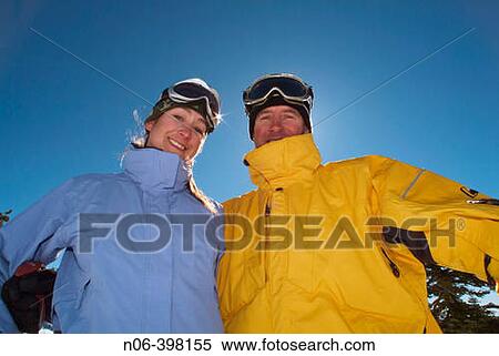 A couple taking a break while skiing at Diamond Peak. Nevada. USA View Large Photo Image Stock Photography - A couple taking a break while skiing at Diamond Peak. Nevada. USA. Fotosearch