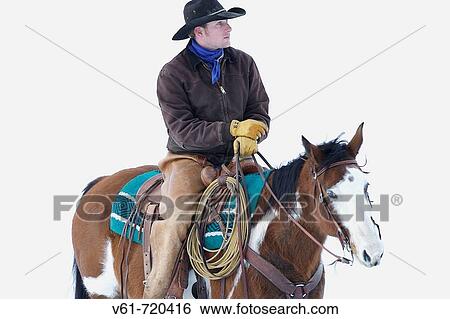 A cowboy out for a ride in winter, Shell, Wyoming, Usa View Large Photo Image Stock Photograph - A cowboy out for a ride in winter, Shell, Wyoming, Usa. Fotosearch
