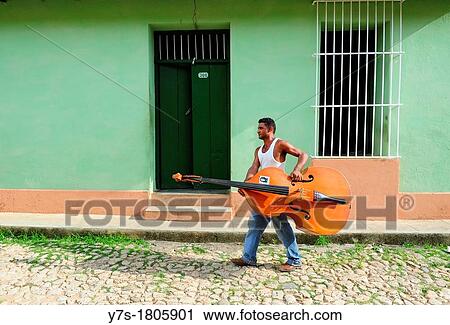 A Cuban musician off to work in Trinidad, Sancti Spiritus Province, Cuba View Large Photo Image Stock Image - A Cuban musician off to work in Trinidad, Sancti Spiritus Province, Cuba. Fotosearch