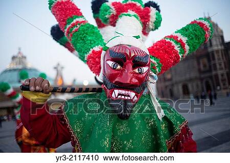 A dancer from Chocaman, Veracruz, dressed as a red devil, dances the Danza de los Santiagos at the pilgrimage to Our Lady of Guadalupe Basilica in Mexico City, Mexico, December 8, 2013. View Large Photo Image Stock Image - A dancer from Chocaman, Veracruz, dressed as a red devil, dances the Danza de los Santiagos at the pilgrimage to Our Lady of Guadalupe Basilica in Mexico City, Mexico, December 8, 2013.. Fotosearch