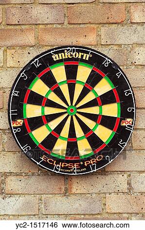 Stock Photograph - A dartboard on an exterior wall. Fotosearch