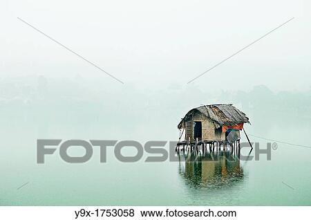 Stock Photo - A desolate house out on the West Lake, a large freshwater lake in Hanoi, Vietnam. Fotosearch