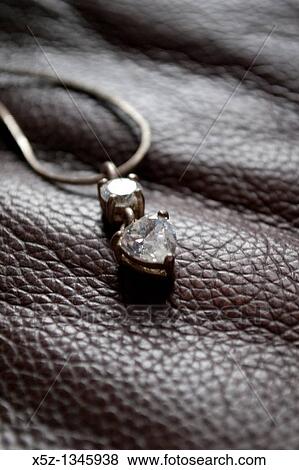 Stock Photo - A diamond heart necklace. Fotosearch