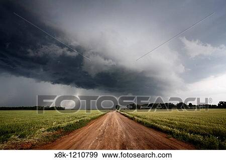 A dirt road leads into the arcus cloud of a severe thunderstorm in northern Oklahoma, May 12, 2010 View Large Photo Image Stock Photo - A dirt road leads into the arcus cloud of a severe thunderstorm in northern Oklahoma, May 12, 2010. Fotosearch