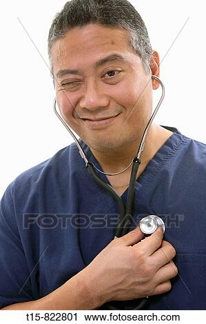 a doctor turns the stethoscope on himself View Large Photo Image Stock Image - a doctor turns the stethoscope on himself. Fotosearch