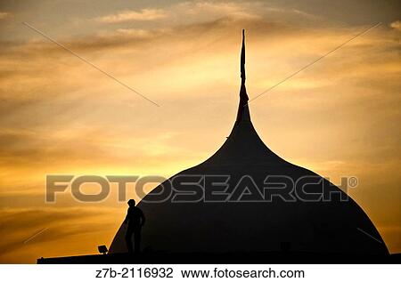 Stock Image - A dome in Castilla region in a evening with a silhouelette of a man.. Fotosearch