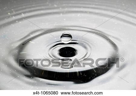 A droplet of water falling into a puddle and creating ripples View Large Photo Image Stock Image - A droplet of water falling into a puddle and creating ripples. Fotosearch