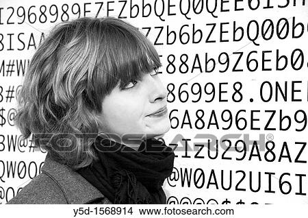 A face of young woman in front of numbers, letters, symbols, background is a painted wall of one of buildings in Geneva, Switzerland View Large Photo Image Picture - A face of young woman in front of numbers, letters, symbols, background is a painted wall of one of buildings in Geneva, Switzerland. Fotosearch