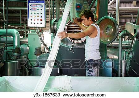 Stock Photo - A factory and research laboratory where fabric is researched, produced and manufactured. Fotosearch