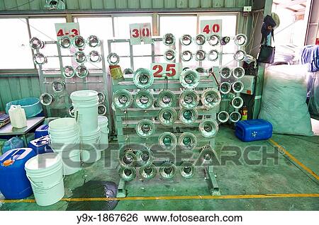 A factory and research laboratory where fabric is researched, produced and manufactured View Large Photo Image Stock Photograph - A factory and research laboratory where fabric is researched, produced and manufactured. Fotosearch