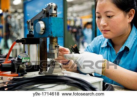 A factory employee clamping and soding the smaller parts of the switchgears. View Large Photo Image Stock Photo - A factory employee clamping and soding the smaller parts of the switchgears.. Fotosearch