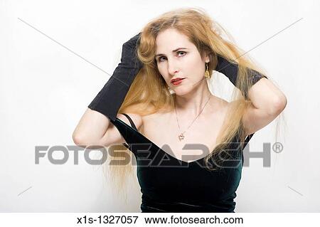 A fair skinned woman with very long blond hair View Large Photo Image Stock Photo - A fair skinned woman with very long blond hair. Fotosearch