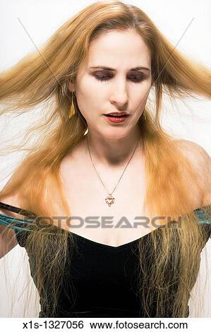 A fair skinned woman with very long blond hair View Large Photo Image Stock Photograph - A fair skinned woman with very long blond hair. Fotosearch