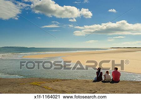 A family admiring the view on a sunny day at The Millennium Coastal park, Burryport, Carmarthenshire South Wales UK View Large Photo Image Stock Image - A family admiring the view on a sunny day at The Millennium Coastal park, Burryport, Carmarthenshire South Wales UK. Fotosearch