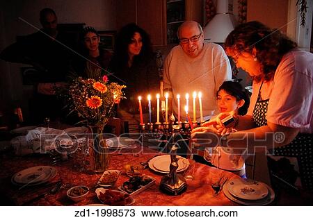 A family is lighting a candle for the Jewish holiday of Hanukkah. Hanukkah or Chanukah, Chanukkah, or Chanuka, also known as the Festival of Lights, is an eight-day Jewish holiday. Hanukkah is observed for eight nights and days. View Large Photo Image Stock Image - A family is lighting a candle for the Jewish holiday of Hanukkah. Hanukkah or Chanukah, Chanukkah, or Chanuka, also known as the Festival of Lights, is an eight-day Jewish holiday. Hanukkah is observed for eight nights and days.. Fotosearch