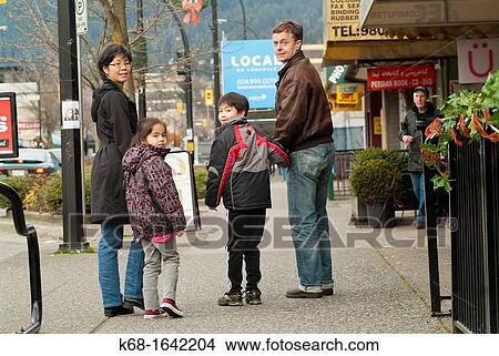 A family of four in North Vancouver, BC, Canada View Large Photo Image Picture - A family of four in North Vancouver, BC, Canada. Fotosearch