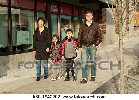 Stock Image - A family of four in North Vancouver, BC, Canada. Fotosearch