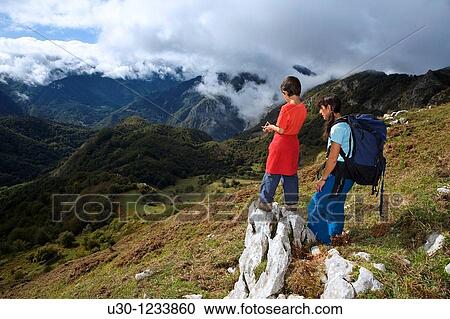 A family practicing mountaineering in the Cornion massif, in the Picos de Europa National Park, Sajambre Valley, Leon, Castilla y Leon Spain View Large Photo Image Stock Image - A family practicing mountaineering in the Cornion massif, in the Picos de Europa National Park, Sajambre Valley, Leon, Castilla y Leon Spain. Fotosearch