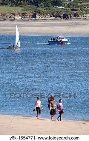 Stock Image - a family stroll along the camel estuary at padstow in cornwall, england, uk. Fotosearch