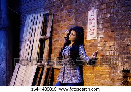 A fashion model at night in downtown Spokane, Washington, USA View Large Photo Image Stock Image - A fashion model at night in downtown Spokane, Washington, USA. Fotosearch