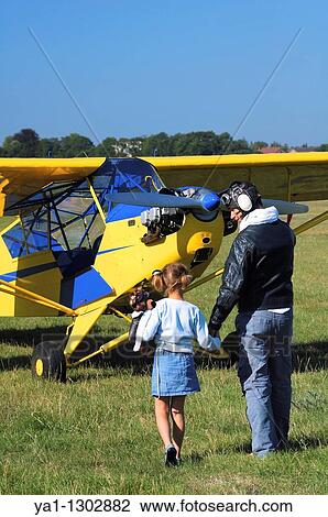 A father private pilot with his young daughter around a famous Piper J-3 Cub View Large Photo Image Stock Image - A father private pilot with his young daughter around a famous Piper J-3 Cub. Fotosearch