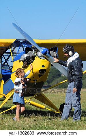 A father private pilot with his young daughter around a famous Piper J-3 Cub View Large Photo Image Stock Image - A father private pilot with his young daughter around a famous Piper J-3 Cub. Fotosearch