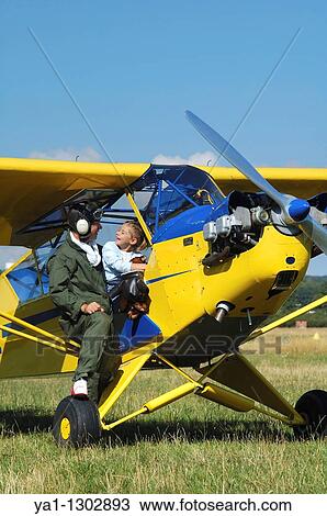 A father private pilot with his young daughter in the famous Piper J-3 Cub View Large Photo Image Stock Image - A father private pilot with his young daughter in the famous Piper J-3 Cub. Fotosearch