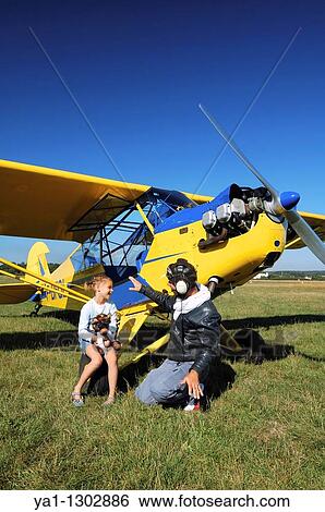 A father private pilot with his young daughter learning a flying lesson around a famous Piper J-3 Cub View Large Photo Image Stock Photograph - A father private pilot with his young daughter learning a flying lesson around a famous Piper J-3 Cub. Fotosearch
