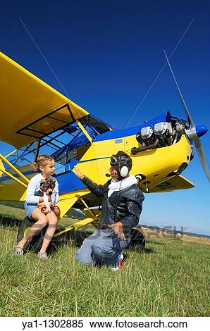 A father private pilot with his young daughter learning a flying lesson around a famous Piper J-3 Cub View Large Photo Image Stock Photography - A father private pilot with his young daughter learning a flying lesson around a famous Piper J-3 Cub. Fotosearch