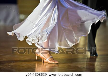 Stock Photo - A female dancer doing ballroom dancing. Fotosearch
