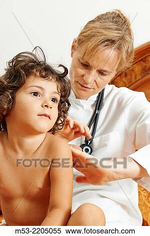 Stock Photography - A female doctor checking a girl during an home visit.. Fotosearch