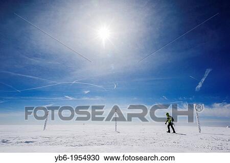 A female trekker walking in a winter landscape, Sklarska Poreba, Poland. View Large Photo Image Stock Image - A female trekker walking in a winter landscape, Sklarska Poreba, Poland.. Fotosearch