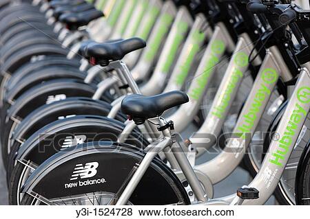 A few of the bicycles of the New Balance Hubway Bike Sharing system launched on July 28, 2011 in Boston, Massachusetts, USA View Large Photo Image Stock Photo - A few of the bicycles of the New Balance Hubway Bike Sharing system launched on July 28, 2011 in Boston, Massachusetts, USA. Fotosearch