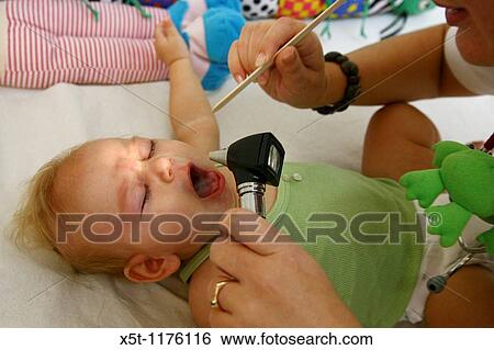 A five month old baby girl during routine visit at the doctor View Large Photo Image Stock Photograph - A five month old baby girl during routine visit at the doctor. Fotosearch