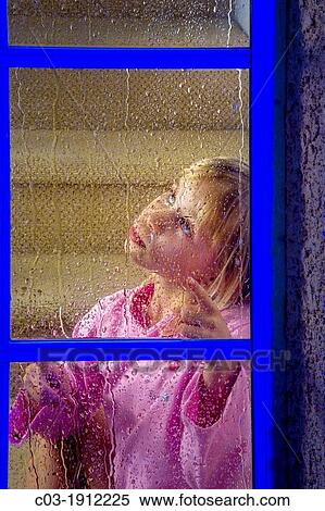 A five-year-old girl looks out her window at night in suburban Lake Forest, CA View Large Photo Image Stock Photography - A five-year-old girl looks out her window at night in suburban Lake Forest, CA. Fotosearch