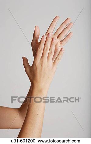 Stock Image - A flamenco dancer claps her hands. Fotosearch