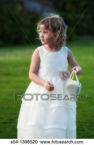 A flower girl for an outdoor wedding on Oahu, Hawaii, USA. View Large Photo Image Stock Image - A flower girl for an outdoor wedding on Oahu, Hawaii, USA.. Fotosearch