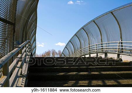 A footbridge crossing over a highway in Brooklyn in New York View Large Photo Image Picture - A footbridge crossing over a highway in Brooklyn in New York. Fotosearch