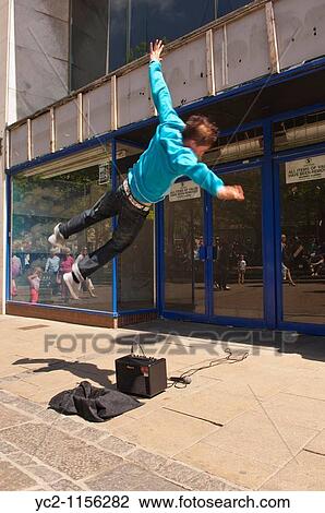 A Free Runner busking and showing movement in the streets of Norwich, Norfolk, England, Great Britain, Uk View Large Photo Image Stock Image - A Free Runner busking and showing movement in the streets of Norwich, Norfolk, England, Great Britain, Uk. Fotosearch