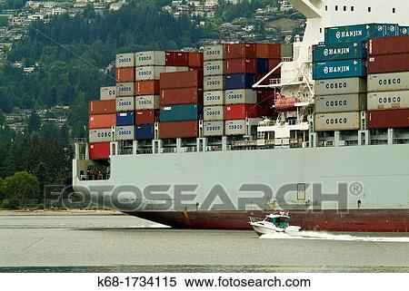 A freighter ship enters the harbour in Vancouver, BC, Canada View Large Photo Image Stock Photography - A freighter ship enters the harbour in Vancouver, BC, Canada. Fotosearch
