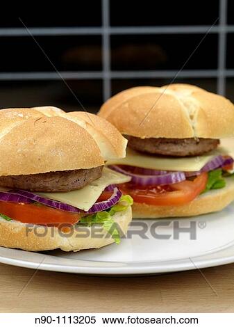 Stock Photography - A freshly made American style hamburger with sauce. Fotosearch