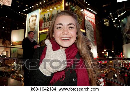 a girl, 16, smiles by a brick wall View Large Photo Image Picture - a girl, 16, smiles by a brick wall. Fotosearch