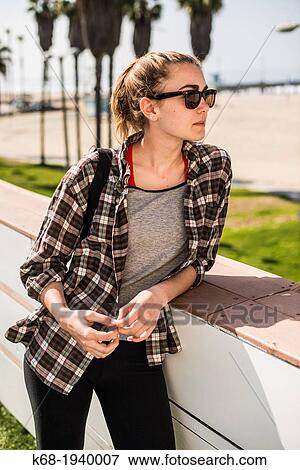 a girl, 17, looks at the view of Venice Beach, Los Angeles, California, USA View Large Photo Image Stock Photo - a girl, 17, looks at the view of Venice Beach, Los Angeles, California, USA. Fotosearch