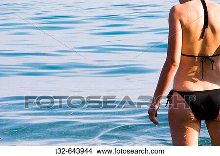 A girl is just having a swim in the sea View Large Photo Image Picture - A girl is just having a swim in the sea. Fotosearch