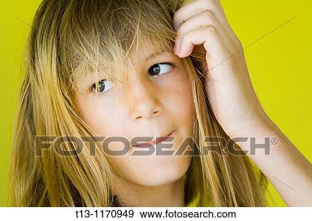 A girl is licking her lips barely showing tongue View Large Photo Image Stock Photo - A girl is licking her lips barely showing tongue. Fotosearch
