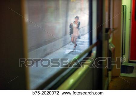 a girl walking in motion seen from the window of a train in Morocco View Large Photo Image Stock Image - a girl walking in motion seen from the window of a train in Morocco. Fotosearch