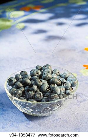 A glass bowl filled with delicious blueberries View Large Photo Image Stock Photo - A glass bowl filled with delicious blueberries. Fotosearch