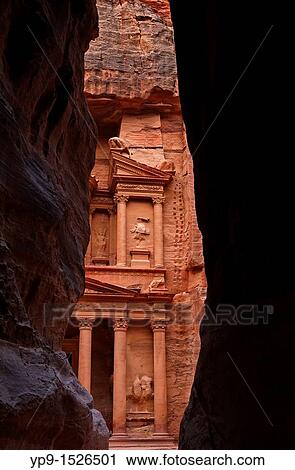 Stock Image - A glimpse of Al Khazneh, the Treasury, from the Siq, Petra, Jordan. Fotosearch